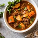 This easy slow cooker beef stew is hearty, healthy, and quick to prepare. Your crock pot will do all of the work, making this soup perfect for a weeknight dinner or meal prep recipe. It's paleo, Whole30, gluten-free, and super filling with the variety of vegetables and stew meat! #whole30beefstew #whole30slowcooker #slowcookerbeefstew #paleobeefstew #whole30beefrecipes #whole30souprecipes