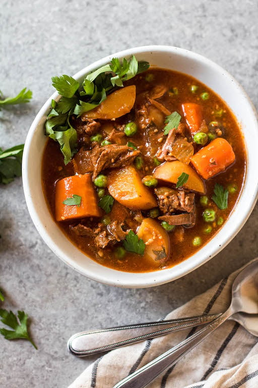 This easy slow cooker beef stew is hearty, healthy, and quick to prepare. Your crock pot will do all of the work, making this soup perfect for a weeknight dinner or meal prep recipe. It's paleo, Whole30, gluten-free, and super filling with the variety of vegetables and stew meat! #whole30beefstew #whole30slowcooker #slowcookerbeefstew #paleobeefstew #whole30beefrecipes #whole30souprecipes