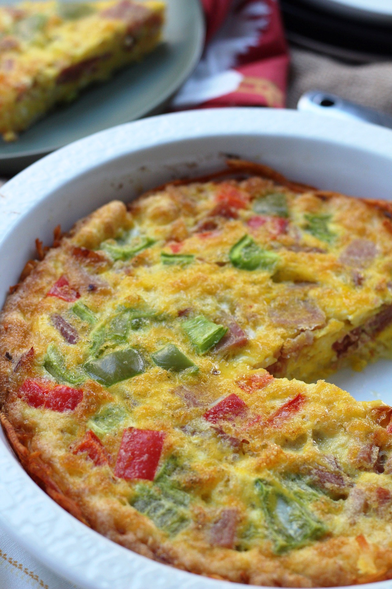 Paleo ham egg bake is the perfect family friendly leftover ham recipe. It works for both hosting a brunch or simple Whole30 meal prep to have grab-and-go breakfasts for the week. Everyone loves the hash brown crust in this Whole30 breakfast casserole too! #whole30eggbake #paleoeggbake #paleoham