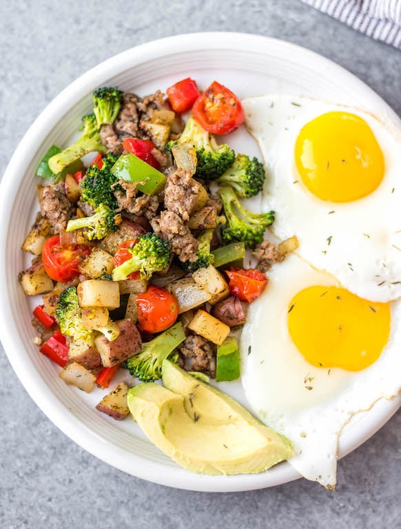 This is the easiest Whole30 and egg free breakfast! Mediterranean breakfast hash, or breakfast skillet, is a one pan recipe that comes together in under 30 minutes. It's full of hearty vegetables like potatoes, onions and broccoli, and seasoned to perfection. It's a perfect paleo or gluten-free meal prep recipe that reheats well, or family friendly option for a quick morning meal. #whole30breakfast #whole30eggfree #breakfastskillet #breakfasthash #glutenfree