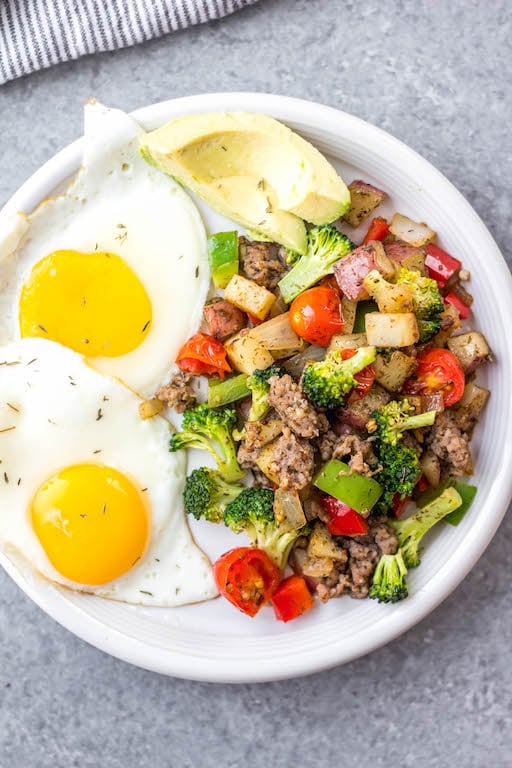 This is the easiest Whole30 and egg free breakfast! Mediterranean breakfast hash, or breakfast skillet, is a one pan recipe that comes together in under 30 minutes. It's full of hearty vegetables like potatoes, onions and broccoli, and seasoned to perfection. It's a perfect paleo or gluten-free meal prep recipe that reheats well, or family friendly option for a quick morning meal. #whole30breakfast #whole30eggfree #breakfastskillet #breakfasthash #glutenfree