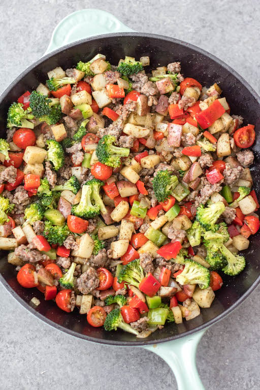 This is the easiest Whole30 and egg free breakfast! Mediterranean breakfast hash, or breakfast skillet, is a one pan recipe that comes together in under 30 minutes. It's full of hearty vegetables like potatoes, onions and broccoli, and seasoned to perfection. It's a perfect paleo or gluten-free meal prep recipe that reheats well, or family friendly option for a quick morning meal. #whole30breakfast #whole30eggfree #breakfastskillet #breakfasthash #glutenfree
