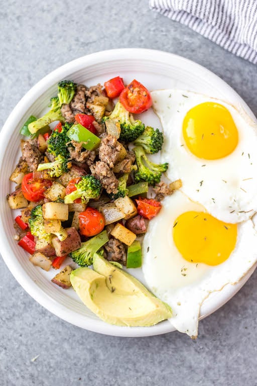 This is the easiest Whole30 and egg free breakfast! Mediterranean breakfast hash, or breakfast skillet, is a one pan recipe that comes together in under 30 minutes. It's full of hearty vegetables like potatoes, onions and broccoli, and seasoned to perfection. It's a perfect paleo or gluten-free meal prep recipe that reheats well, or family friendly option for a quick morning meal. #whole30breakfast #whole30eggfree #breakfastskillet #breakfasthash #glutenfree