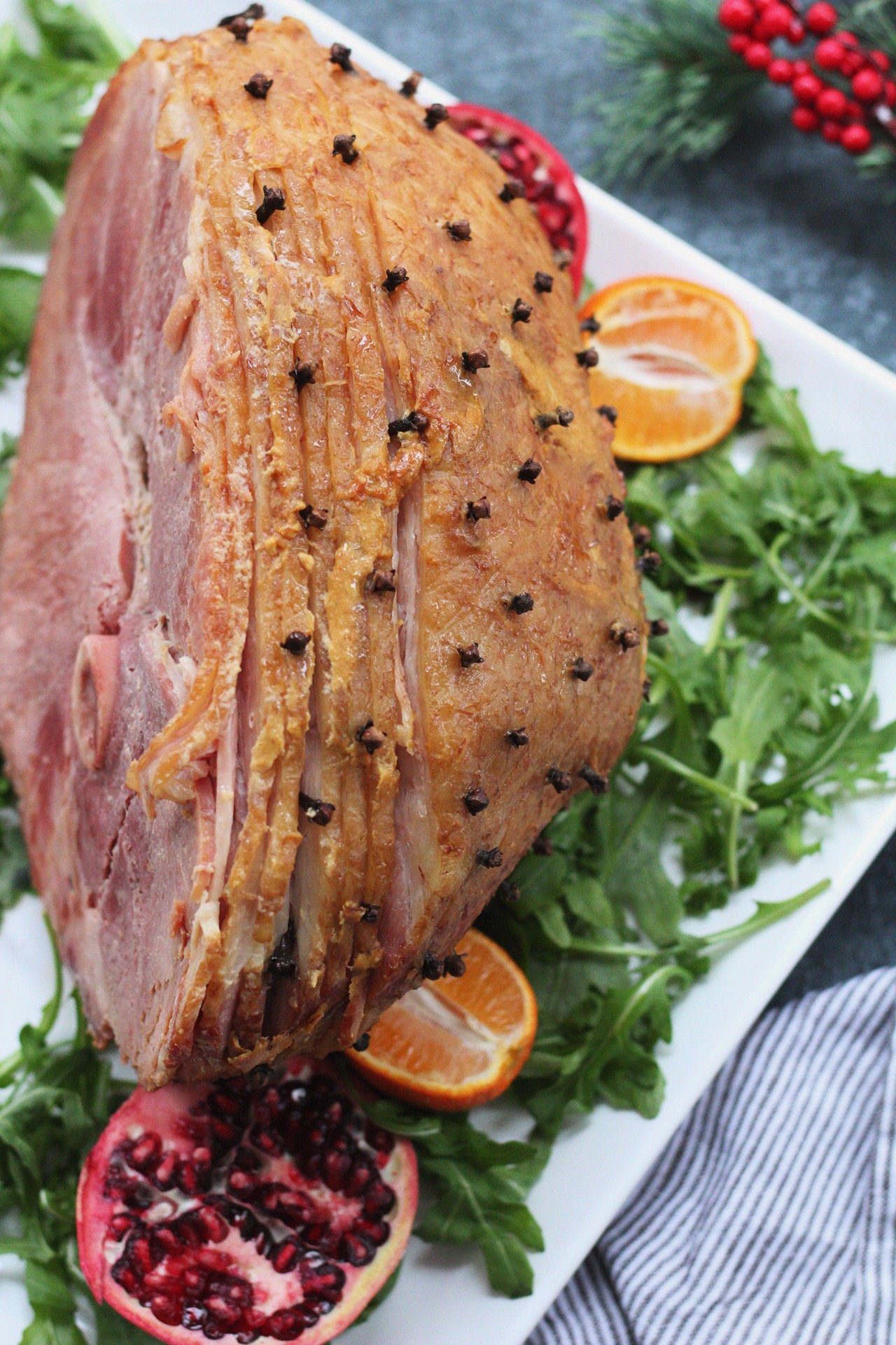 Three ingredient Whole30 holiday ham is a family friendly recipe everyone will enjoy. Made with a sugar free ham, this clean eating recipe will be a hit. With a simple recipe, it's quick and easy so you get in and out of the kitchen! #holidayham #paleoham #whole30ham #paleoholidayrecipes