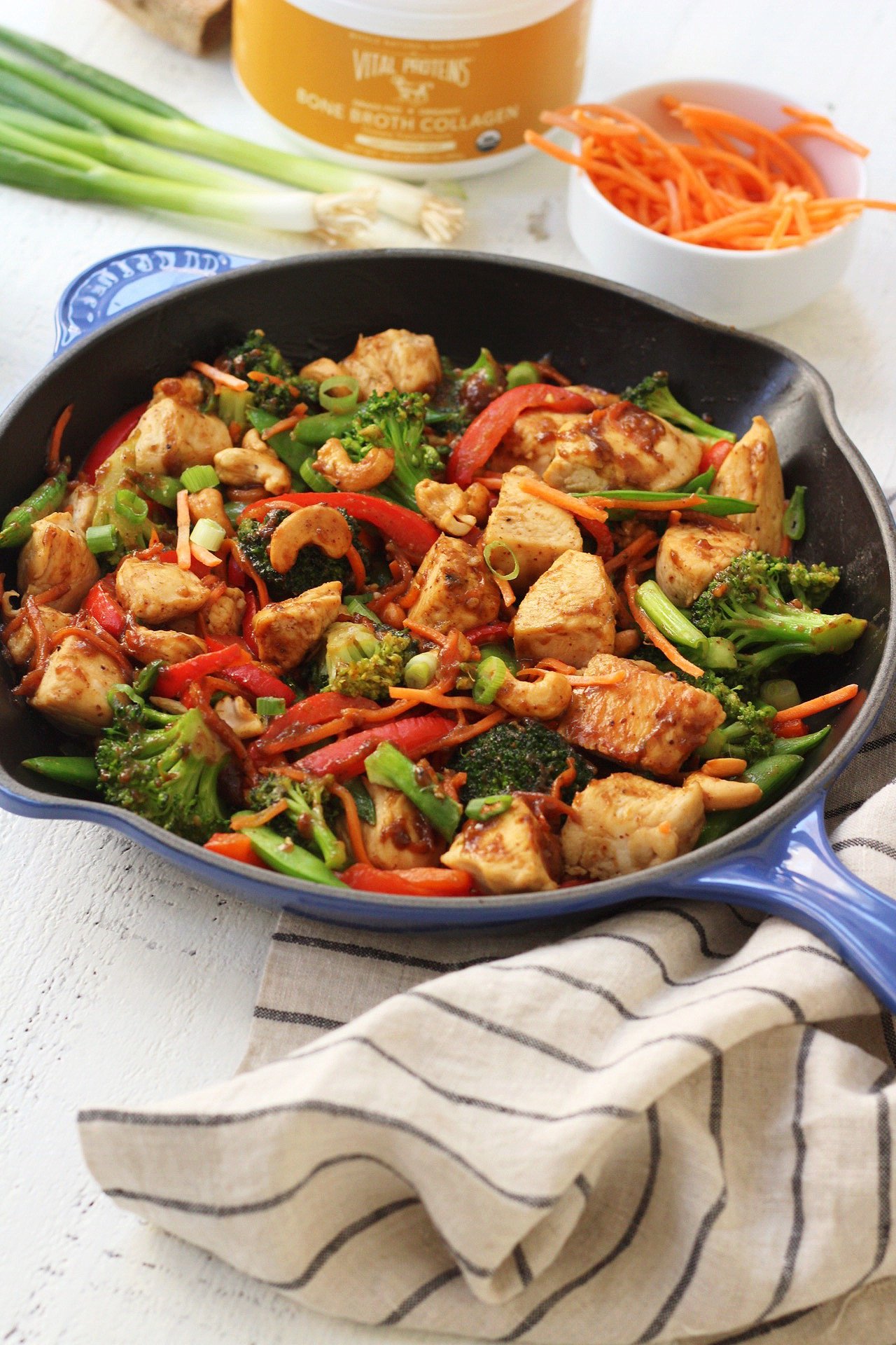 This easy paleo cashew chicken recipe will make healthy eating both delicious and easy whether you're doing a Whole30 or not! It's made completely in one pot, and in under 30 minutes. It's a family friendly, takeout fake-out recipe that's totally good for you! It's even made with a Paleo almond butter "peanut sauce"! #whole30cashewchicken #paleocashewchicken #whole30chickenstirfry #paleochickenrecipes