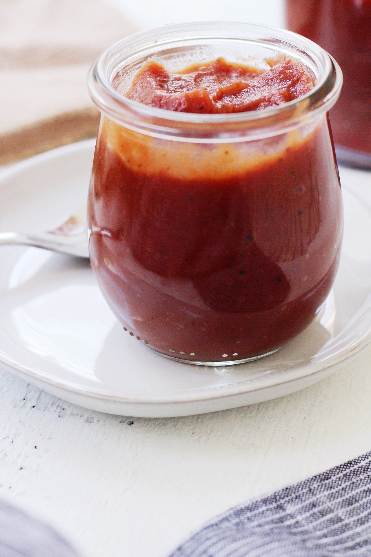 Whole30 BBQ sauce is an easy condiment to whip up in your own kitchen. The paleo BBQ is also vegan and 100% a sugar free BBQ option! It's great to keep around for pulled pork, BBQ grilled chicken, ribs, you name it! #paleobbqsauce #whole30bbqsauce #sugarfreebbq