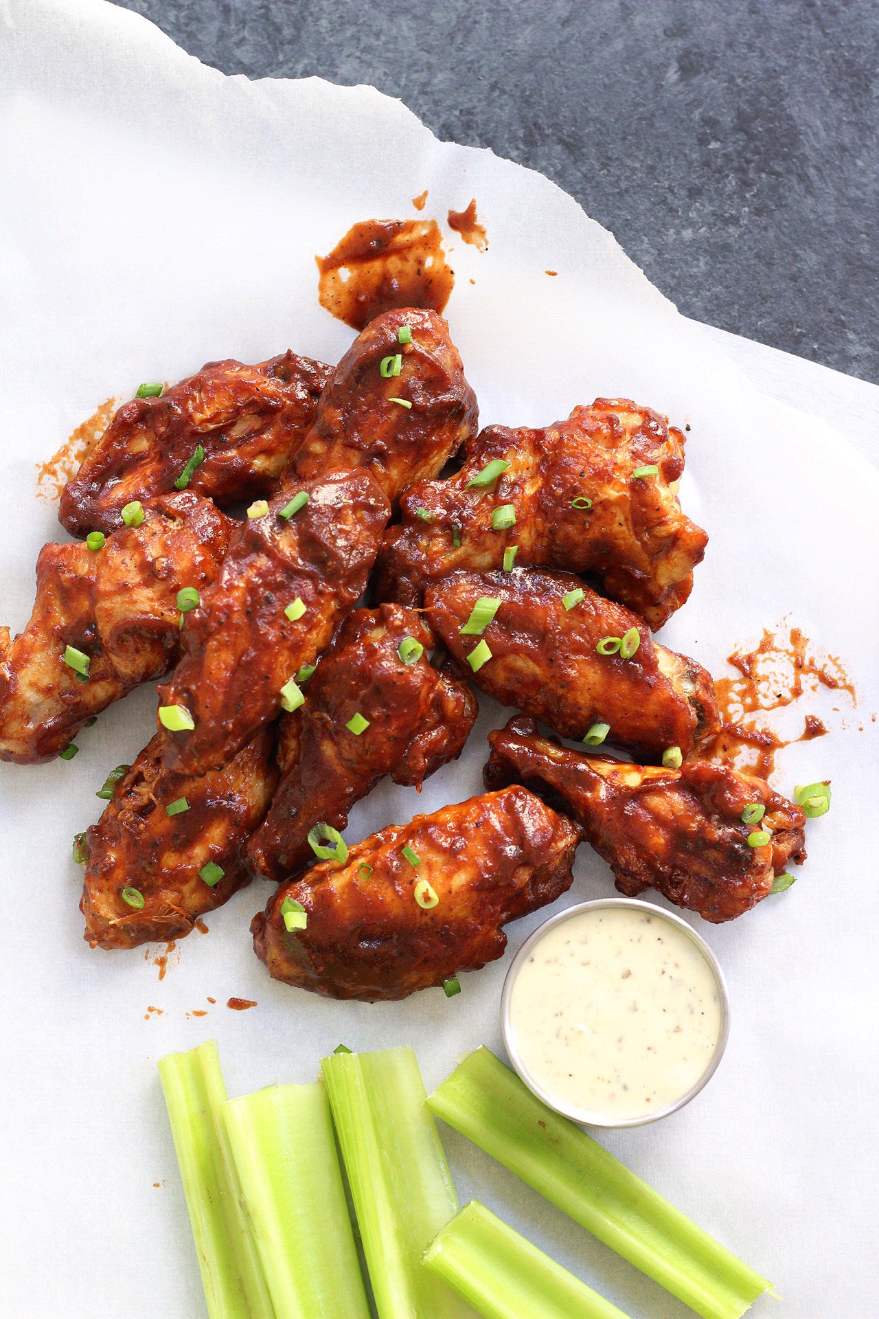 Healthy, low carb BBQ wings in the air fryer! This paleo air fryer chicken wing recipe is Whole30 and doesn't leave you any dishes to wash! #whole30airfryer #airfryerwings #airfryerpaleo #airfryerketo