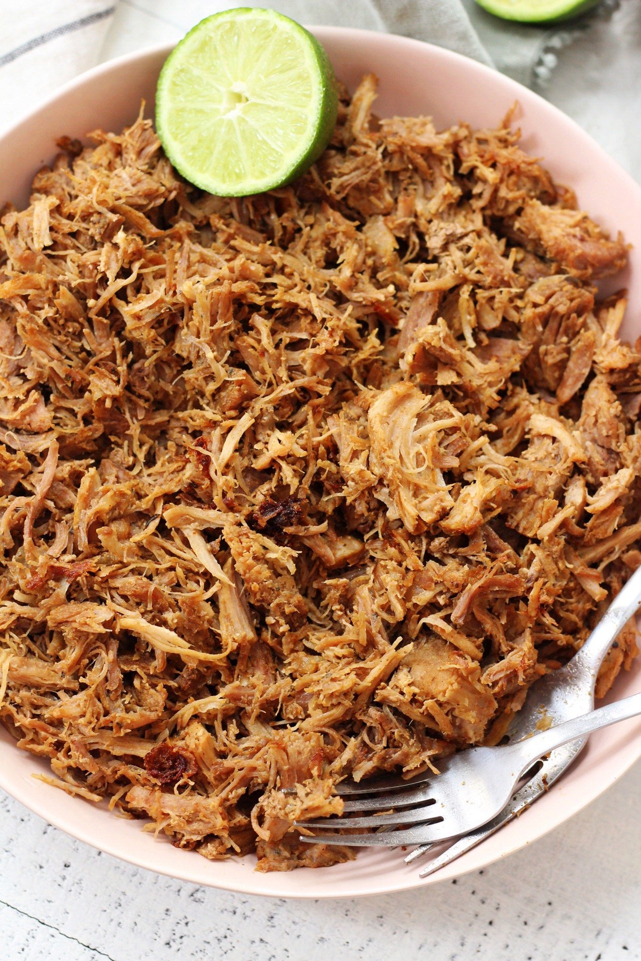 Easy Whole30 and Paleo instant pot pork carnitas only take a few simple ingredients and less than an hours time to cook perfectly! This is a great whole30 pork recipe for meal prep, or as a family friendly recipes for tacos or burritos! #paleocarnitas #whole30instantpot #whole30carnitas