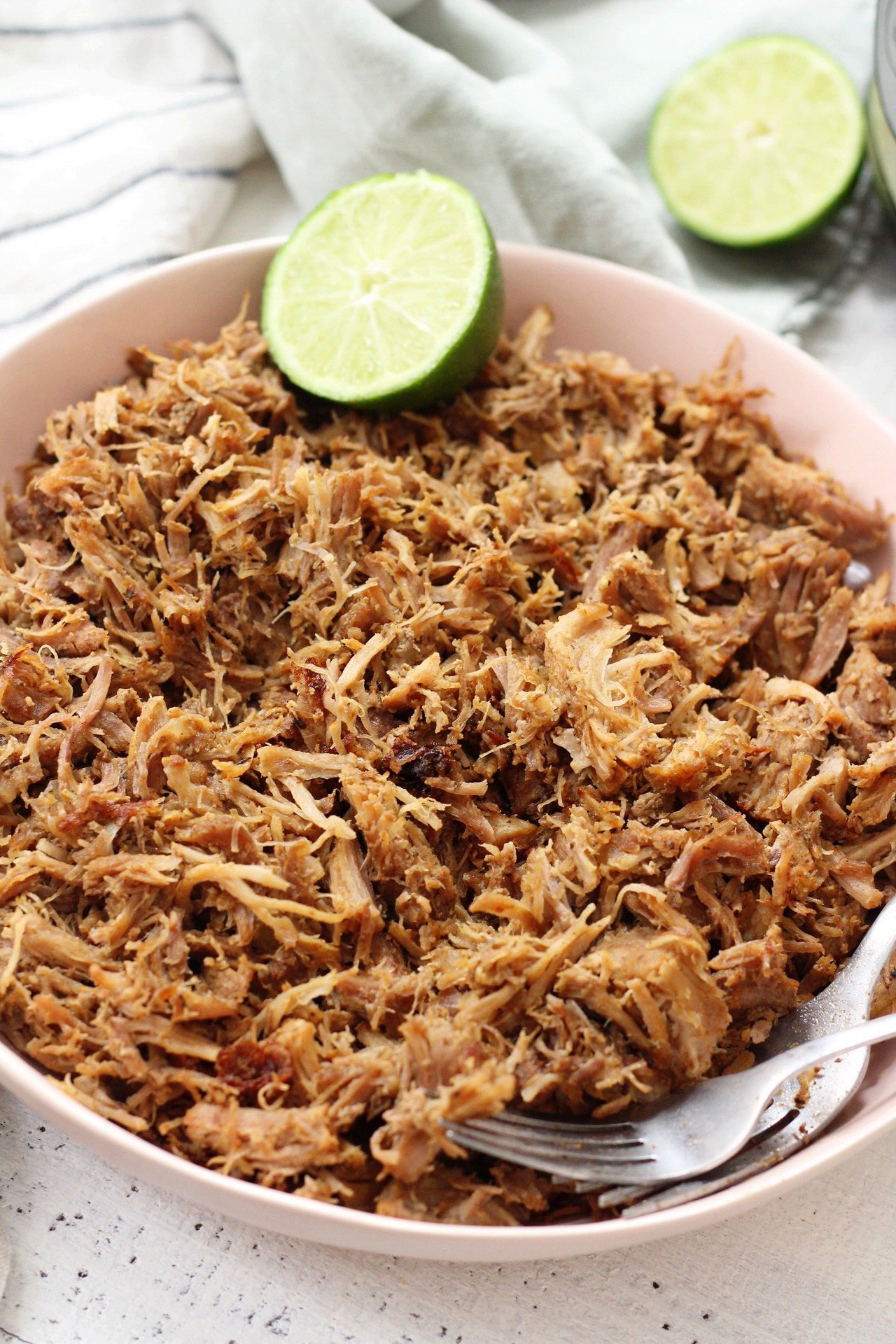 Easy Whole30 and Paleo instant pot pork carnitas only take a few simple ingredients and less than an hours time to cook perfectly! This is a great whole30 pork recipe for meal prep, or as a family friendly recipes for tacos or burritos! #paleocarnitas #whole30instantpot #whole30carnitas