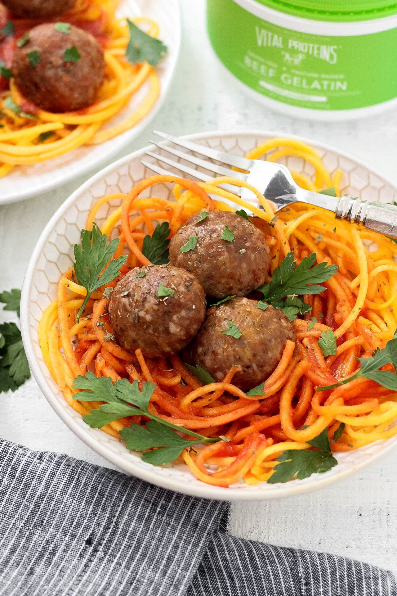 This easy meatball recipe is tried and true and the best way to make meatballs! Made paleo and Whole30 but still every bit as juicy and delicious. Served over butternut squash noodles and marinara here, the ways you can enjoy this low carb meatball recipe is endless!