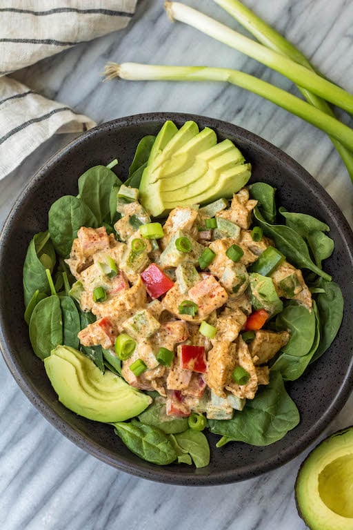 This easy taco chicken salad is a family friendly paleo recipe that only takes 15 minutes to whip together. No cooking needed! It's a great Whole30 salad for meal prep or Whole30 side dish for any event! #paleochickensalad #whole30chickensalad #whole30side