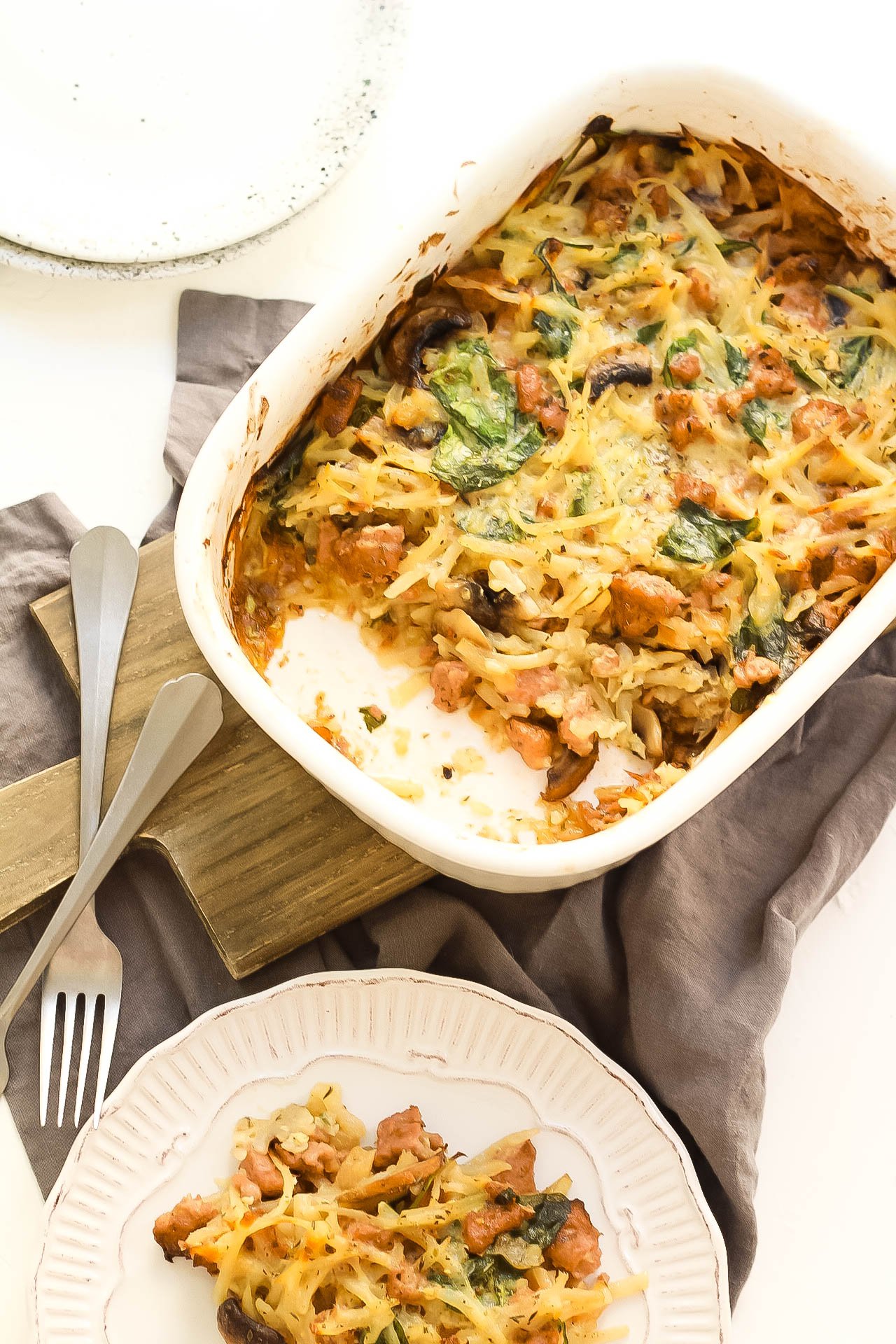 This creamy Whole30 casserole is the perfect easy and family friendly dinner. It's with sausage and potatoes in under an hour and is a creamy, comforting Paleo or Whole30 recipe. It would be great for meal prep, and I think the leftovers are almost more delicious! #whole30casserole #paleocasserole #whole30recipes #paleorecipes