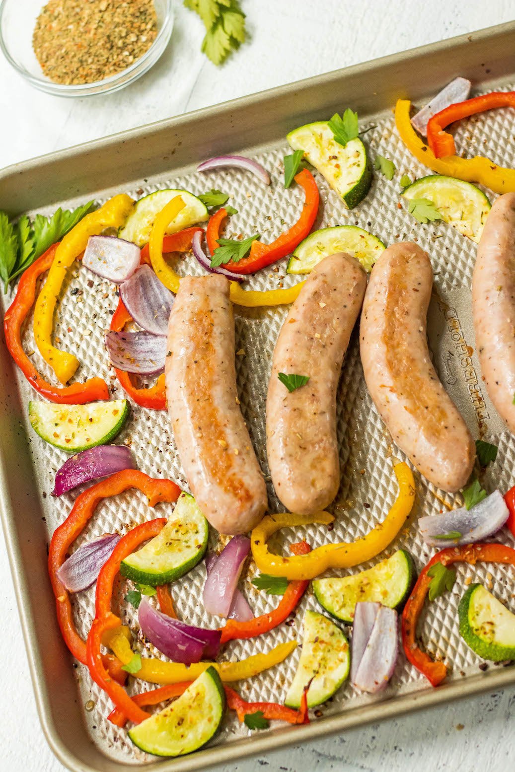 This Whole30 sheet pan sausage recipe is the perfect healthy weeknight dinner option that's family friendly, and clean up free! Or it makes an easy Paleo, Whole30 or keto meal prep recipe to keep your meal plan simple. Using chicken sausage, lots of veggies and delicious seasonings, dinner will be done in 30 minutes! #whole30sheetpan #whole30sausage #paleosheetpan #ketosheetpan