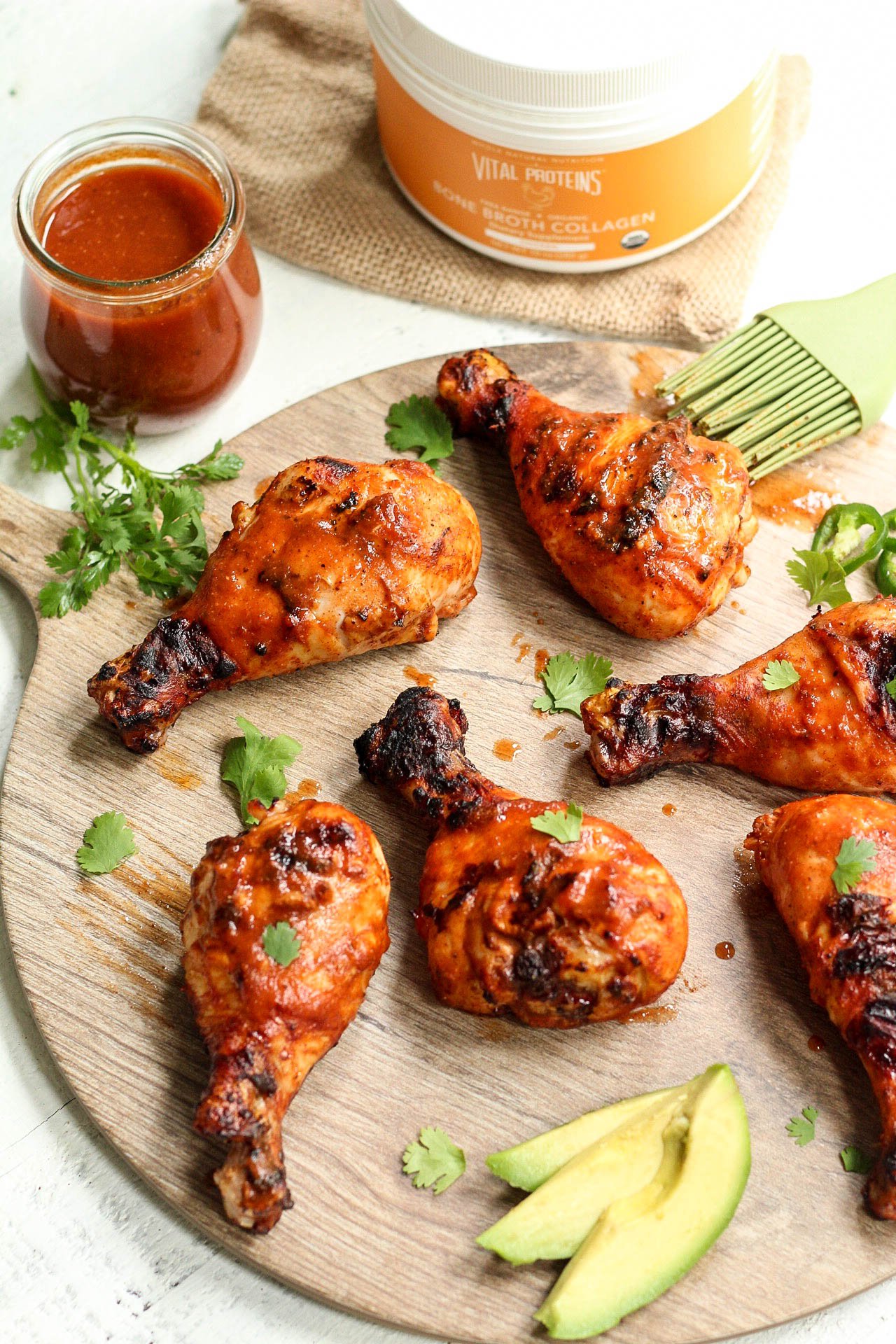 These fiesta Whole30 chicken drumsticks are marinaded in the best ever homemade Paleo and Whole30 taco sauce. The homemade taco sauce is only a few simple ingredients, and when you throw the chicken drumsticks on the grill, you have an easy dinner or protein for meal prep in under 30 minutes! Even if you want to use the oven baked method, these are the best tasting marinaded drumsticks! #whole30chickendrumsticks #homemadetacosauce #paleochickenrecipes #whole30tacosauce