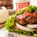 These stuffed Whole30 bacon burgers are going to be the star of your next outdoor get-together. They're easy to make on the grill or on the stovetop, and perfectly customizable for all of your party guests! These juicy burgers are full of flavor, topped with the best condiments, and great for dinner no matter if you're eating keto, Paleo or Whole30! #whole30burgers #ketoburgers #paleoburgers #whole30beefrecipes #ketobeefrecipes