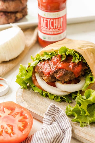 These stuffed Whole30 bacon burgers are going to be the star of your next outdoor get-together. They're easy to make on the grill or on the stovetop, and perfectly customizable for all of your party guests! These juicy burgers are full of flavor, topped with the best condiments, and great for dinner no matter if you're eating keto, Paleo or Whole30! #whole30burgers #ketoburgers #paleoburgers #whole30beefrecipes #ketobeefrecipes