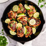 These crispy Whole30 cilantro lime chicken thighs are so delicious, and so easy to make. The skin gets perfectly crispy using this simple cooking method. They're awesome for meal prepping, or for an easy weeknight dinner. Not only are these Whole30 chicken thighs, but they're Paleo, gluten free and low carb too! #chickenthighs #cilantrolime #whole30chicken #lowcarbchicken