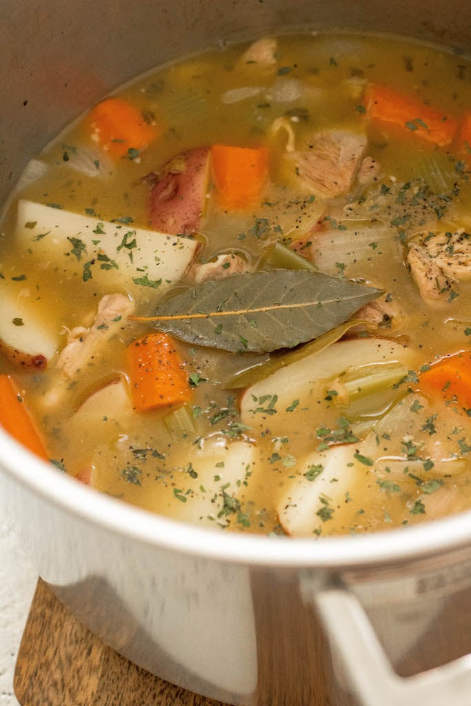 This easy 30 minute Whole30 chicken soup is every bit as healing as it is simple. There's nothing like a cozy, hearty and healthy chicken soup. This paleo chicken soup is made without the junk but with all the flavor. With instant pot instructions, and stovetop directions, this will definitely be a fall favorite for your family! #whole30soup #whole30chickensoup #whole30instantpot #paleochickensoup