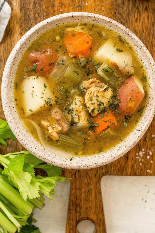 This easy 30 minute Whole30 chicken soup is every bit as healing as it is simple. There's nothing like a cozy, hearty and healthy chicken soup. This paleo chicken soup is made without the junk but with all the flavor. With instant pot instructions, and stovetop directions, this will definitely be a fall favorite for your family! #whole30soup #whole30chickensoup #whole30instantpot #paleochickensoup