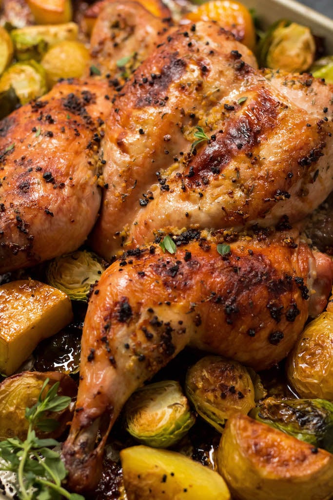 This garlic butterfly chicken is so easy to make and results in the best tasting chicken ever! It's Whole30, Paleo, Keto, you name it because it's just chicken and some good ol' fashioned seasoning. Also known as spatchcock chicken, pared with the veggies you've got an easy chicken dinner recipe on one sheet pan. It's a great weeknight meal that makes the best Whole30 leftovers! #whole30chicken #butterflychicken #easydinnerrecipes