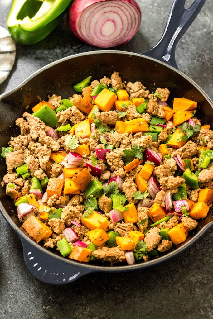 This Whole30 turkey breakfast skillet is a quick and easy, family friendly egg free breakfast. It's perfect for meal prep,  and you can always add an egg to it! It's filling and hearty, and full of flavorful veggies and spices. One pan meals are the way to go for fast meal prepping, and this Whole30 breakfast skillet is the ticket to an easy morning! #whole30breakfast #whole30breakfastskillet #paleobreakfast #whole30turkeyrecipes