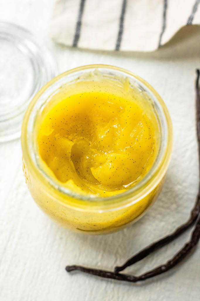 Ghee is a great staple for Paleo, Whole30 or Keto because it offers quality fats, a rich butter flavor but without the dairy! This DIY ghee recipe is made easily in a slow cooker. Homemade ghee is a really budget friendly option, espeically where vanilla ghee is concerned. Vanilla ghee is popular for being used in morning bulletproof coffee for the hint of vanilla flavor, and this option gives you that without the price tag! #vanillaghee #homemadeghee #slowcookerghee #whole30ghee