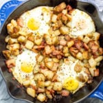 This is one of the easiest and tastiest Whole30 breakfast skillets. These country potatoes, bacon and eggs make a pretty complete and healthy breakfast in only one pan, making clean up a breeze! This paleo breakfast is a classic, and it's always a hearty, filling go-to everyone will love! #whole30breakfast #whole30breakfastskillet #whole30breakfastrecipes #whole30bacon