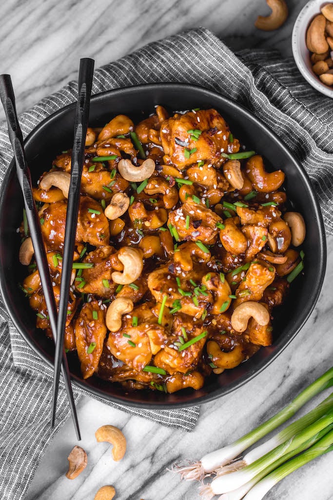 This Whole30 instant pot cashew chicken tastes like the familiar Chinese takeout we all love, but in a better-for-you, Whole30, Paleo, gluten-free version that only takes 30 minutes. No more waiting for your delivery full of MSG! This instant pot paleo cashew chicken is a family friendly meal, I promise even those who don't adhere to a real food diet will love it. #whole30instantpot #paleoinstantpot #whole30chicken #cashewchicken #whole30chickenrecipes