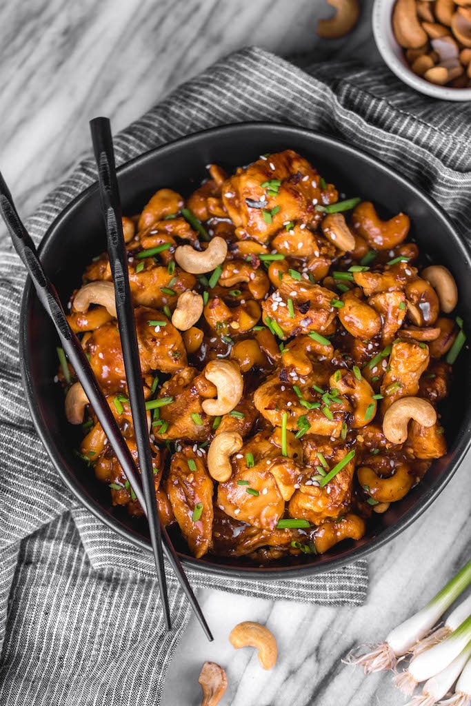 This Whole30 instant pot cashew chicken tastes like the familiar Chinese takeout we all love, but in a better-for-you, Whole30, Paleo, gluten-free version that only takes 30 minutes. No more waiting for your delivery full of MSG! This instant pot paleo cashew chicken is a family friendly meal, I promise even those who don't adhere to a real food diet will love it. #whole30instantpot #paleoinstantpot #whole30chicken #cashewchicken #whole30chickenrecipes