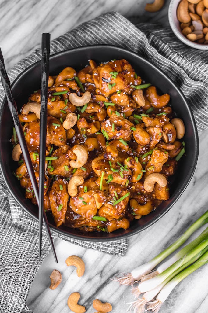 This Whole30 instant pot cashew chicken tastes like the familiar Chinese takeout we all love, but in a better-for-you, Whole30, Paleo, gluten-free version that only takes 30 minutes. No more waiting for your delivery full of MSG! This instant pot paleo cashew chicken is a family friendly meal, I promise even those who don't adhere to a real food diet will love it. #whole30instantpot #paleoinstantpot #whole30chicken #cashewchicken #whole30chickenrecipes