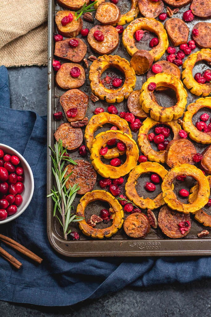 This roasted delicata squash, sweet potato and cranberry recipe is an easy, healthy side dish that has all of the best seasonal fall flavors. Made with real ingredients, it's a simple gluten-free, paleo and Whole30 Thanksgiving or holiday vegetable dish that makes a beautiful statement on the table. #whole30sidedish #delicatasquash #whole30vegetables #whole30holidayrecipes #holidayvegetables