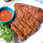 This easy BBQ beef brisket is so simple thanks to help from the instant pot, and it's perfect for an easy weeknight dinner. With the BBQ sauce and only a handful of other ingredients, the Whole30 and Paleo brisket has a classic smoky flavor that the whole family will love. #whole30beef #paleobeef #instantpotbeef #whole30instantpot