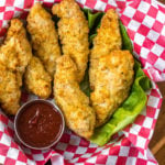 These Whole30 and Paleo air fryer chicken tenders are perfectly crispy on the outside and juicy in the middle. They're a healthy, gluten-free version of the classic chicken strips you can get at any restaurant. They're flavorful, only take a few simple ingredients and 12 minutes to cook! They're something the whole family will love and you'll feel great after eating! #whole30airfryer #whole30chicken #paleoairfryer #paleochicken #whole30recipes