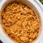 This slow cooker buffalo chicken could not get any easier. It's a Paleo, Whole30 and Keto meal that you can just dump into the slow cooker and come back later to find dinner ready. It's also a great meal prep recipe that can be used for buffalo chicken salads, wraps, tacos and much more. #whole30 #whole30buffalochicken #buffalochicken #slowcookerbuffalochicken #ketoslowcooker #paleo