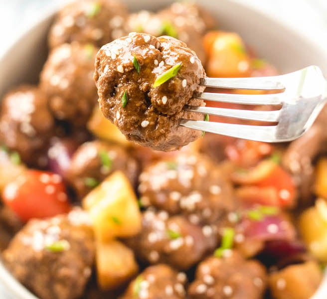 These Paleo and Whole30 sweet and sour meatballs are the perfect weeknight meal or delicious recipe to meal prep. What makes this Asian-inspired recipe even better is that it's done in the slow cooker with little hands-on time. It's a family friendly recipe that everyone is going to love! Plus it's so much healthier than any traditional take out menu item! #whole30recipes #paleorecipes #whole30beef #slowcooker #paleoslowcooker