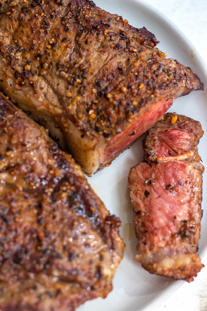 Air Fryer Steak is a foolproof method that comes out perfectly every time. Air fryer steak is a quick weeknight meal for anyone, but especially simplifies things for those eating paleo, Whole30, keto or those simply sticking to eating more real foods. #paleo #whole30 #airfryer #whole30airfryer #paleoairfryer #keto #ketoairfryer #airfryerbeef