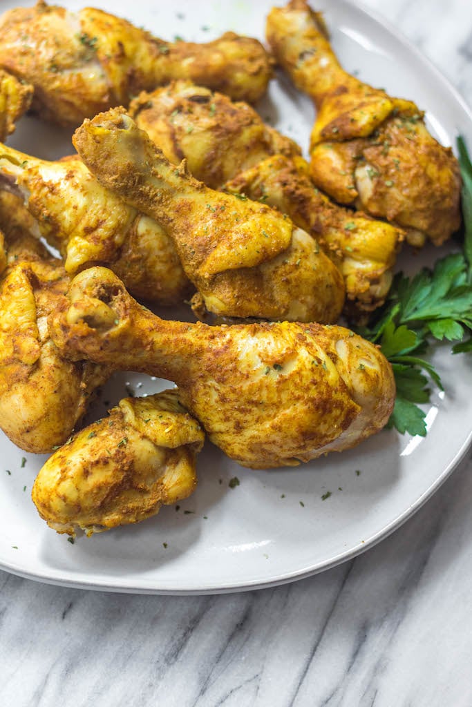 These instant pot tandoori chicken drumsticks make the perfect easy weeknight meal. The blend of Indian spices is quick to prepare and the chicken will satisfy anyone who's eating Paleo, Whole30, Keto (low-carb), or just a real food based diet! With 10 minutes of prep work and few minutes in your instant pot, these tender, flavorful chicken drummies are ready to eat! #whole30instantpot #paleoinstantpot #keto #lowcarb #tandoorichickendrumsticks #whole30chicken