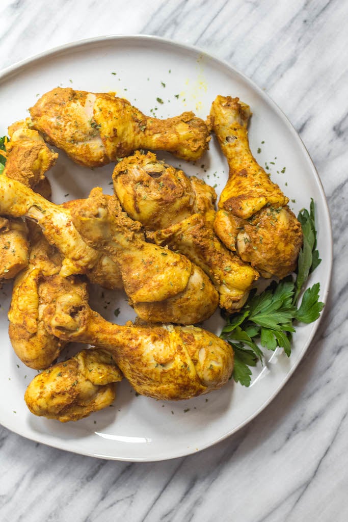 These instant pot tandoori chicken drumsticks make the perfect easy weeknight meal. The blend of Indian spices is quick to prepare and the chicken will satisfy anyone who's eating Paleo, Whole30, Keto (low-carb), or just a real food based diet! With 10 minutes of prep work and few minutes in your instant pot, these tender, flavorful chicken drummies are ready to eat! #whole30instantpot #paleoinstantpot #keto #lowcarb #tandoorichickendrumsticks #whole30chicken