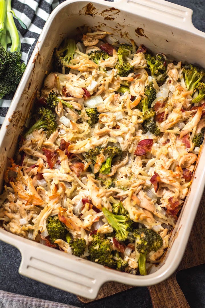 This creamy chicken and bacon alfredo casserole is loaded with veggies from the hash browns and broccoli, and it's paleo, Whole30 compliant, dairy free and gluten free. With only 7 ingredients, it really couldn't be easier to make for a quick weeknight meal or for a simple meal prep recipe. #whole30casserole #whole30chickenrecipes #whole30chickencasserole #paleocasserole #paleochickenrecipes #dairyfreecasserole