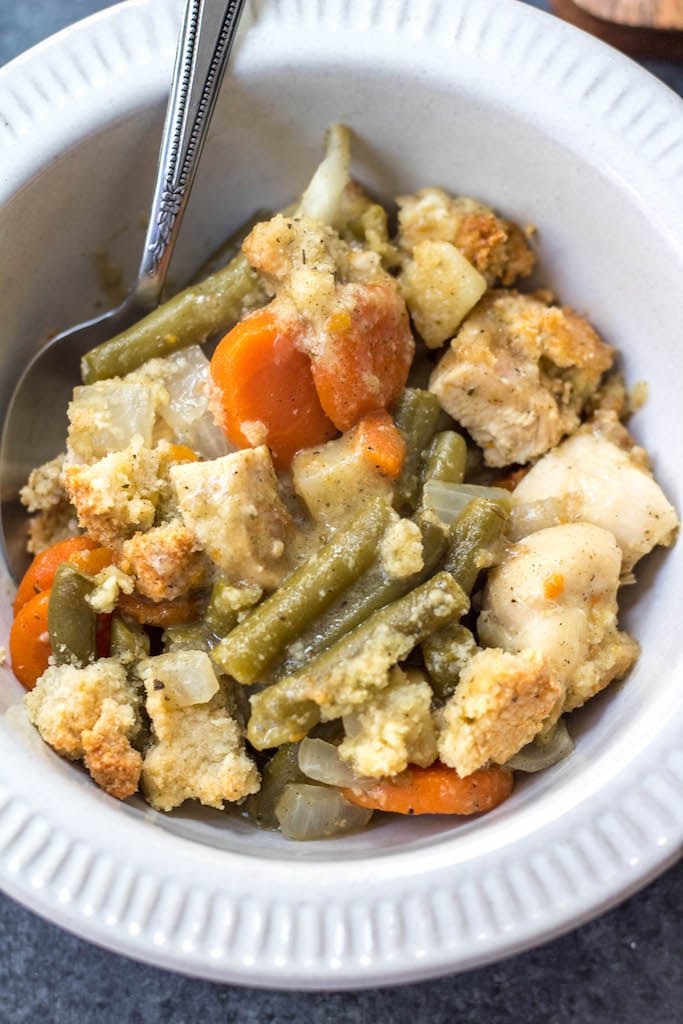 This Whole30 chicken pot pie casserole is the the perfect Whole30 casserole recipe when you're wanting something hearty and comforting. It's a paleo and dairy free twist on the classic pot pie flavors you know and love with a grain free crust, and is awesome for a weeknight meal or for a paleo meal prep recipe because it reheats so well. This is a great family friendly recipe that is sure to become a staple! #whole30casserole #paleocasserole #whole30chickenpotpie #whole30chickenrecipes #paleochickenrecipes