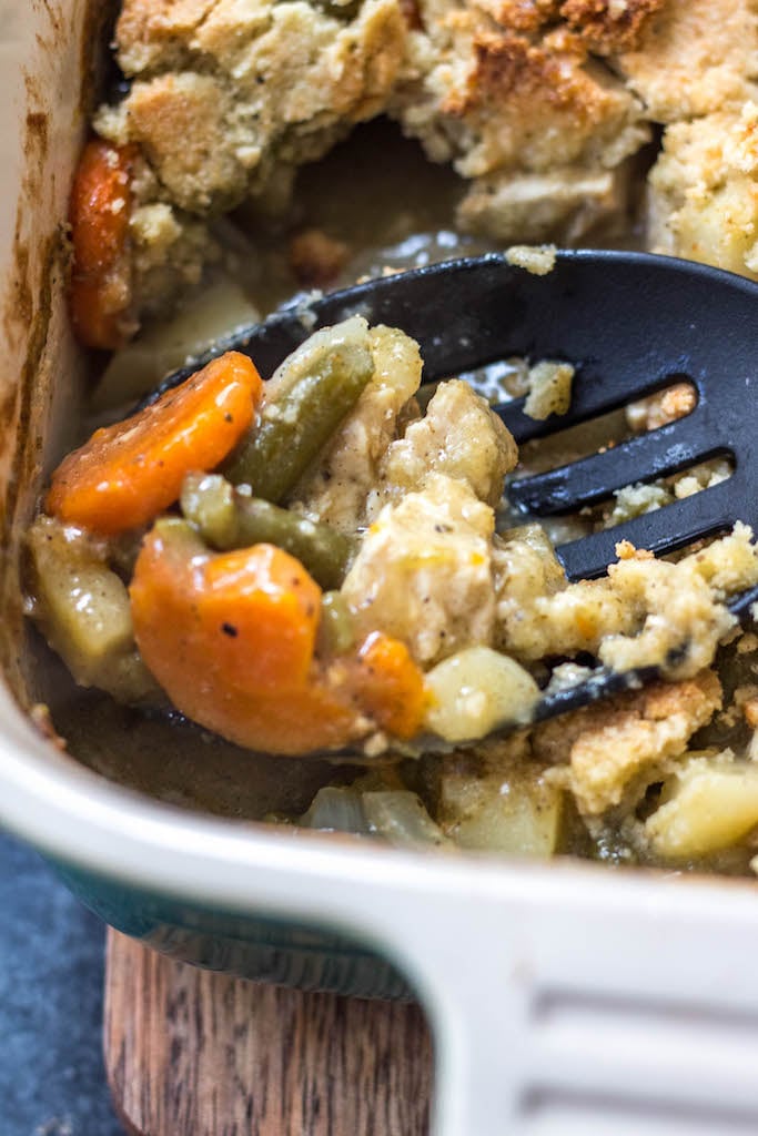 This Whole30 chicken pot pie casserole is the the perfect Whole30 casserole recipe when you're wanting something hearty and comforting. It's a paleo and dairy free twist on the classic pot pie flavors you know and love with a grain free crust, and is awesome for a weeknight meal or for a paleo meal prep recipe because it reheats so well. This is a great family friendly recipe that is sure to become a staple! #whole30casserole #paleocasserole #whole30chickenpotpie #whole30chickenrecipes #paleochickenrecipes