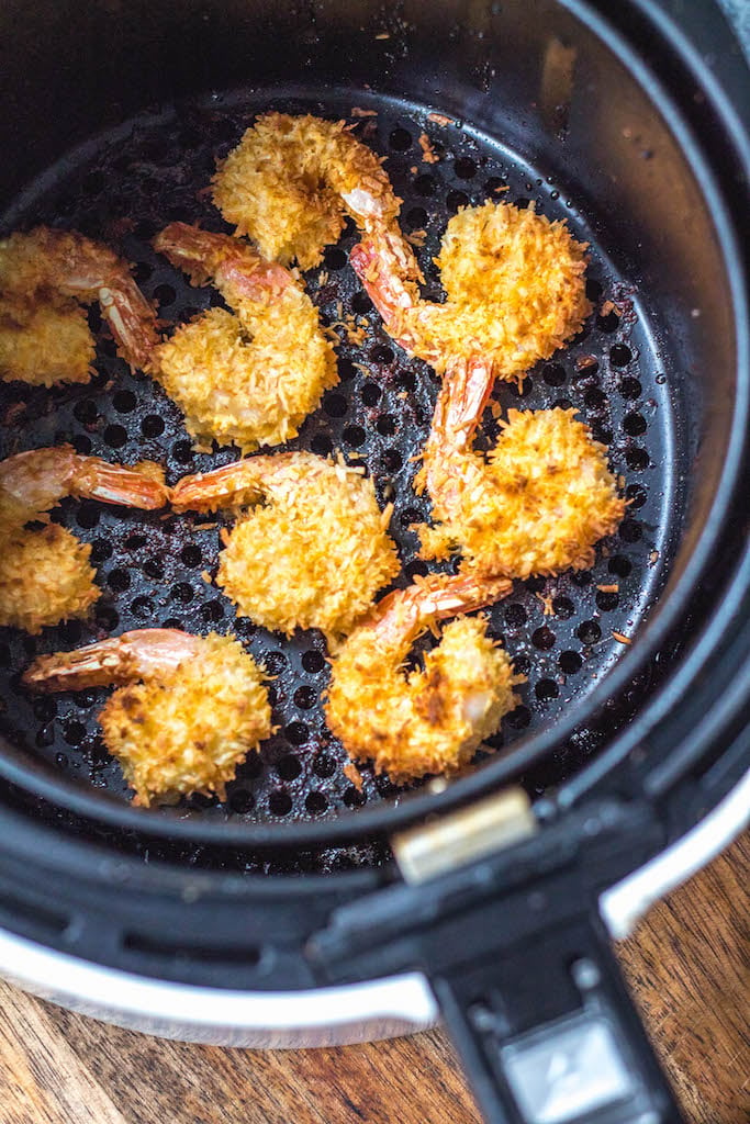 These paleo and Whole30 air fryer coconut shrimp are a healthy, gluten-free and keto alternative compared to deep frying a similar coconut shrimp recipe. With just a few simple ingredients and in less than 15 minutes you’ll have yourself a family friendly and healthy recipe everyone will love, but no one says you have to share! #whole30airfryer #whole30coconutshrimp #paleoairfryer #ketoairfryer #ketococonutshrimp #paleoairfryerrecipes