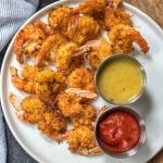 These paleo and Whole30 air fryer coconut shrimp are a healthy, gluten-free and keto alternative compared to deep frying a similar coconut shrimp recipe. With just a few simple ingredients and in less than 15 minutes you’ll have yourself a family friendly and healthy recipe everyone will love, but no one says you have to share! #whole30airfryer #whole30coconutshrimp #paleoairfryer #ketoairfryer #ketococonutshrimp #paleoairfryerrecipes