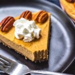 This paleo pumpkin cheesecake is the perfect dairy free and gluten free fall dessert. It's a no bake treat that everyone will love and that only takes a few minutes to prepare in a blender, or food processor. With a delicious pecan crust and creamy pumpkin filling, whether you serve this at a holiday or a cool fall weekend, it's sure to be a hit! It can also easily be made vegan! #paleodessert #paleocheesecake #dairyfreecheesecake #pumpkincheesecake #paleopumpkin