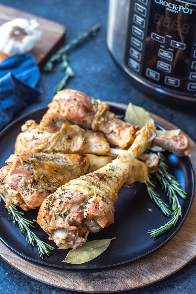 These easy pressure cooker herbed turkey legs are an easy Thanksgiving addition or perfect for just a simple weeknight meal. They’re paleo, Whole30, keto, gluten-free and only take 30 minutes! The herbed butter used helps make the turkey juicy, tender and full of flavor and the gravy is made all in one pot! #whole30pressurecooker #whole30turkey #paleopressurecooker #ketoturkey #turkeylegrecipes #paleothanksgiving