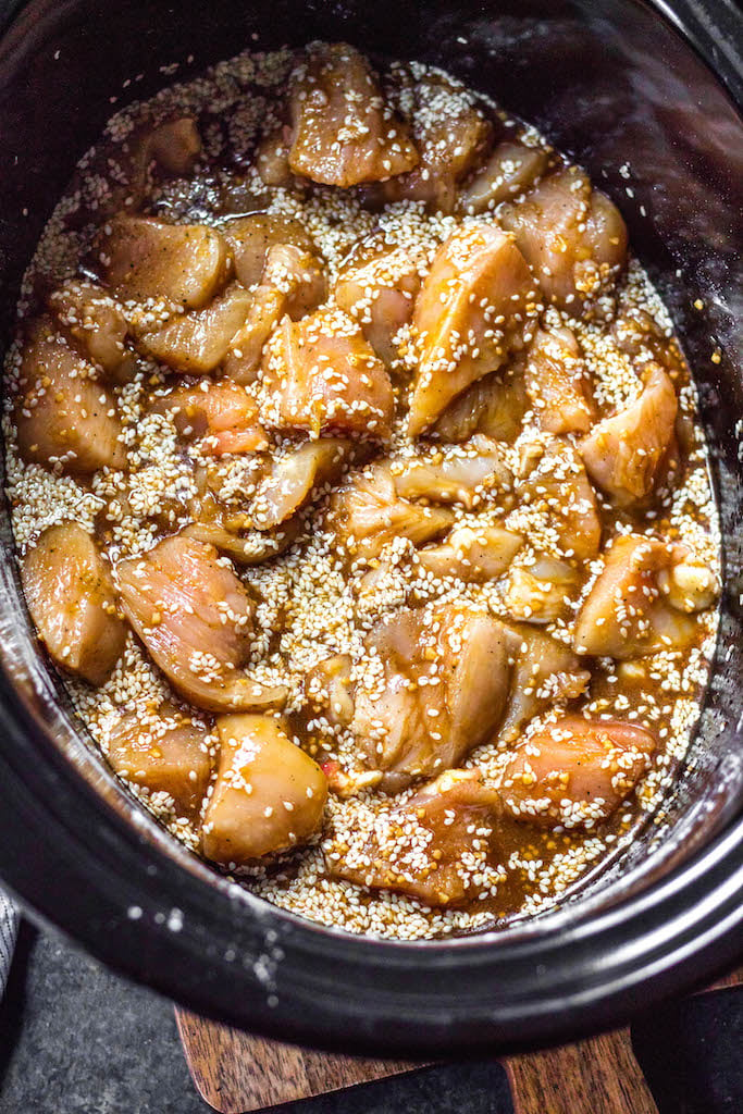 This easy Whole30 slow cooker sesame chicken recipe only calls for a few ingredients and a crock pot, making it an ideal weeknight meal or Whole30 or paleo meal prep recipe. It’s so simple yet has such a great take out fake out flavor for when you’re craving a healthier Chinese food option. #whole30slowcooker #paleoslowcooker #whole30sesamechicken #whole30chickenrecipes #paleochickenrecipes