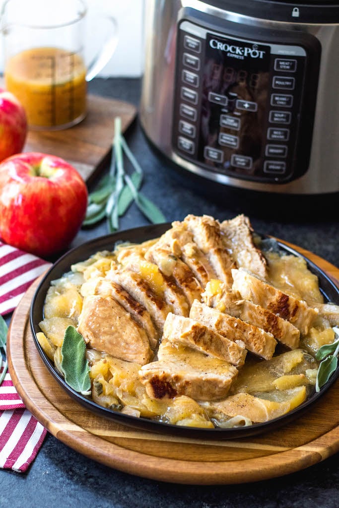 These pressure cooker apple dijon pork tenderloins are a simple fall weeknight meal or great for meal prepping. It's a Paleo, Whole30, gluten-free recipe and made in under 30 minutes. With only a few simple ingredients, this healthy pork tenderloin recipe will be a family favorite that can be on the table in no time #whole30porkrecipes #pressurecookerrecipes #paleoporkrecipes #appledijonporktenderloin #porktenderloin