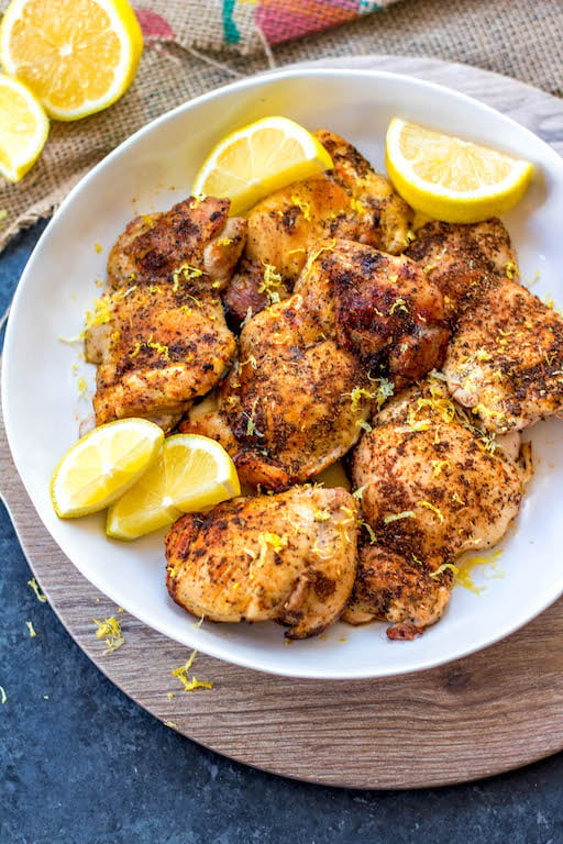 These Paleo and Whole30 air fryer lemon pepper chicken thighs are crispy on the outside and full of juicy flavor on the inside. This keto and gluten free recipe is one of the easiest ways to get dinner on the table or meal prep done in just under 30 minutes. Your family will love it and you’ll love how easy clean up will be! #whole30airfryer #ketoairfryer #airfryerchickenthighs #paleoairfryer