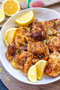 These Paleo and Whole30 air fryer lemon pepper chicken thighs are crispy on the outside and full of juicy flavor on the inside. This keto and gluten free recipe is one of the easiest ways to get dinner on the table or meal prep done in just under 30 minutes. Your family will love it and you’ll love how easy clean up will be! #whole30airfryer #ketoairfryer #airfryerchickenthighs #paleoairfryer