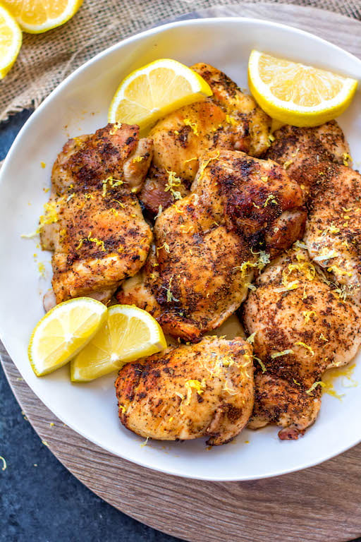 These Paleo and Whole30 air fryer lemon pepper chicken thighs are crispy on the outside and full of juicy flavor on the inside. This keto and gluten free recipe is one of the easiest ways to get dinner on the table or meal prep done in just under 30 minutes. Your family will love it and you’ll love how easy clean up will be! #whole30airfryer #ketoairfryer #airfryerchickenthighs #paleoairfryer